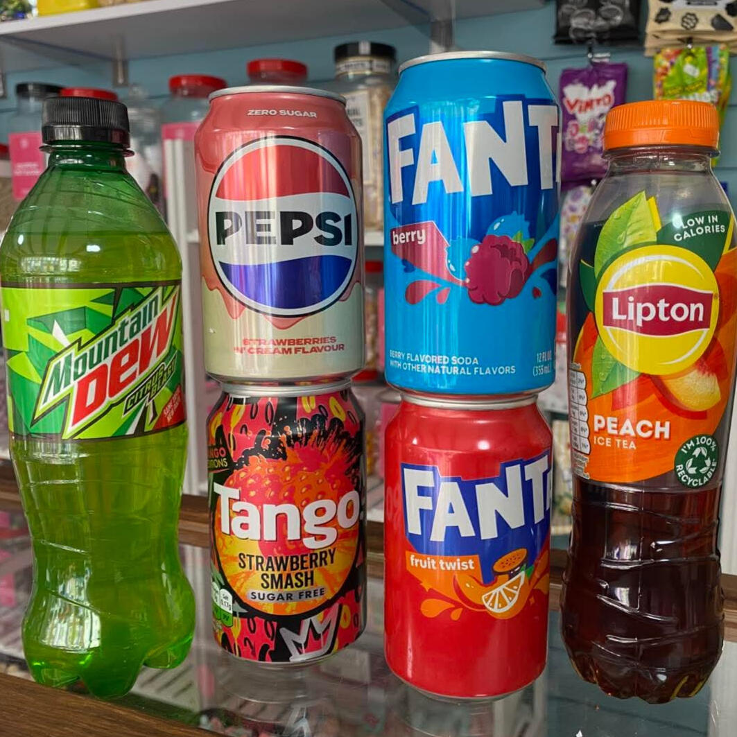 The Olde House Confectioners Drinks A selection of colourful drinks including Pepsi, Fanta, and Mountain Dew.